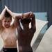 Alec Simon applies hair product before his final dive on Monday, July 22. Daniel Brenner I AnnArbor.com